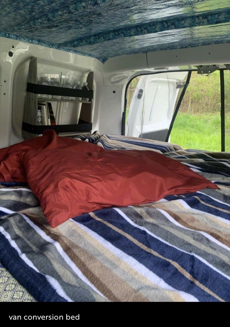 Picture 2/8 of a 2015 Nissan NV200 Converted Plus Rooftop Tent for sale in Winchester, Kentucky