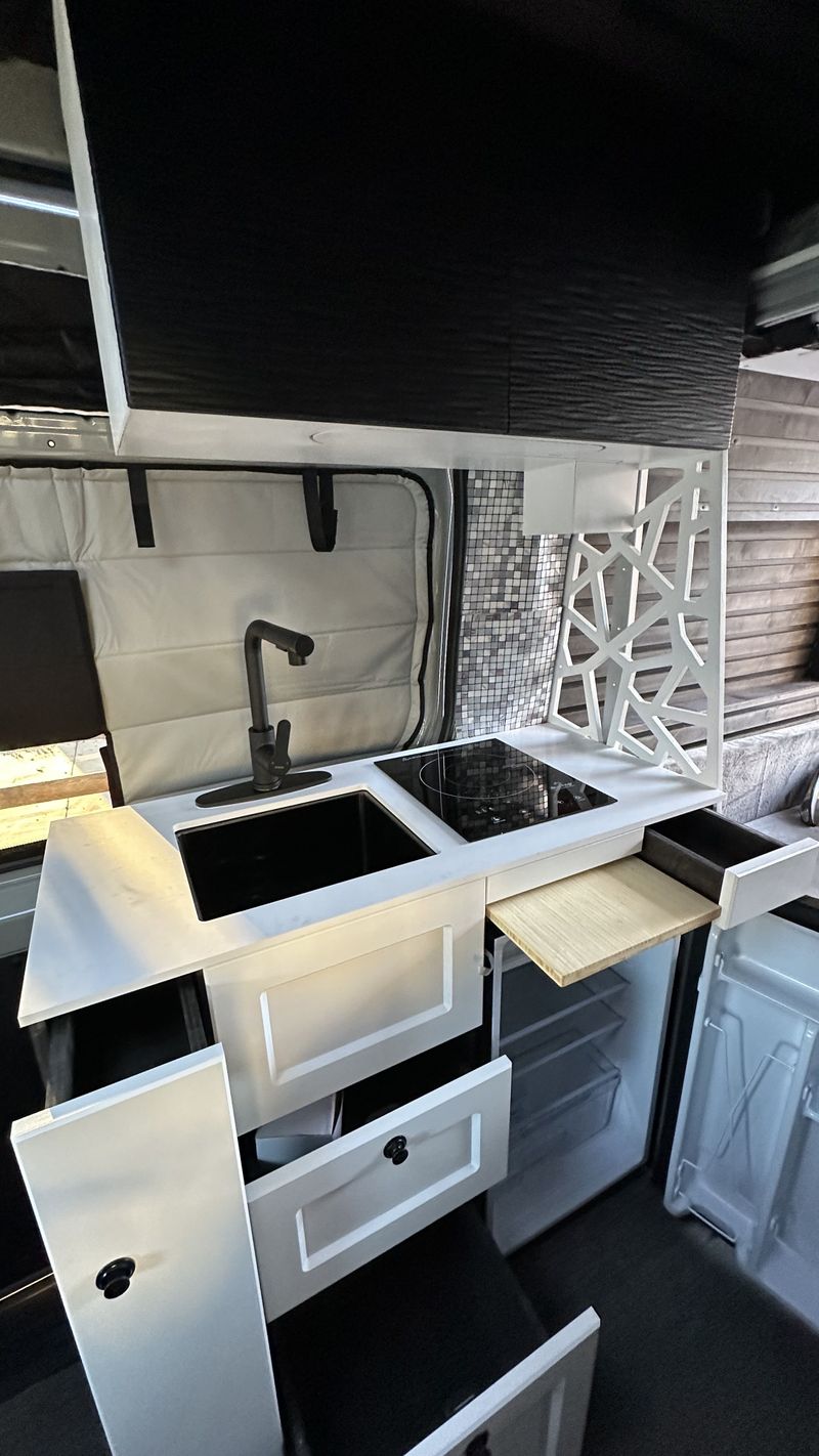 Picture 3/18 of a 144 Sprinter sits & sleeps 5 / ELEVATOR BED / bathroom / A/C for sale in Big Bear City, California