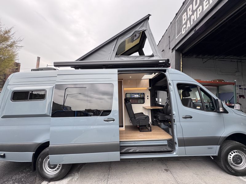 Picture 1/15 of a 2025 Sprinter AWD Sleeps 5 with Pop-Top for sale in Brooklyn, New York
