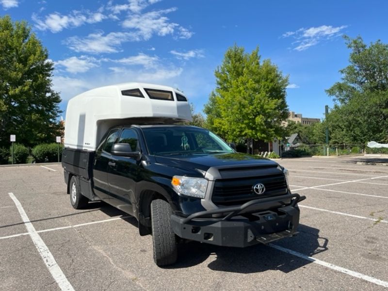 Picture 1/26 of a Toyota Tundra with Flatbed and Fiberglass Camper Shell for sale in Denver, Colorado