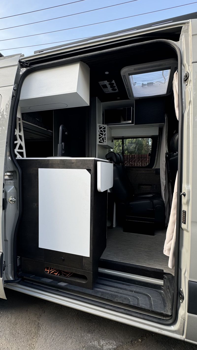 Picture 5/31 of a 144 Sprinter van Sleeps/sits 5 with bathroom & elevator bed  for sale in Big Bear City, California