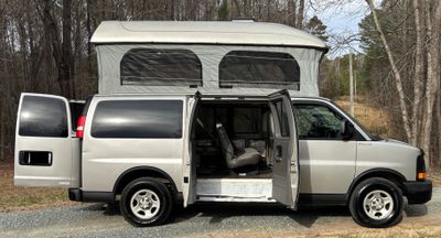 Photo of a Camper Van for sale: One of a kind! Flexible passenger van with huge pop top!