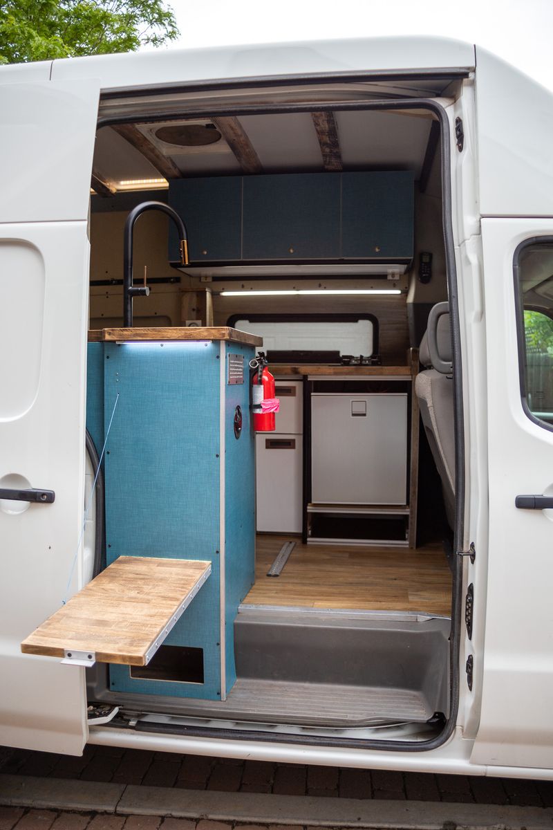 Picture 5/16 of a Nissan NV2500 HD High roof custom camper for sale in Golden, Colorado