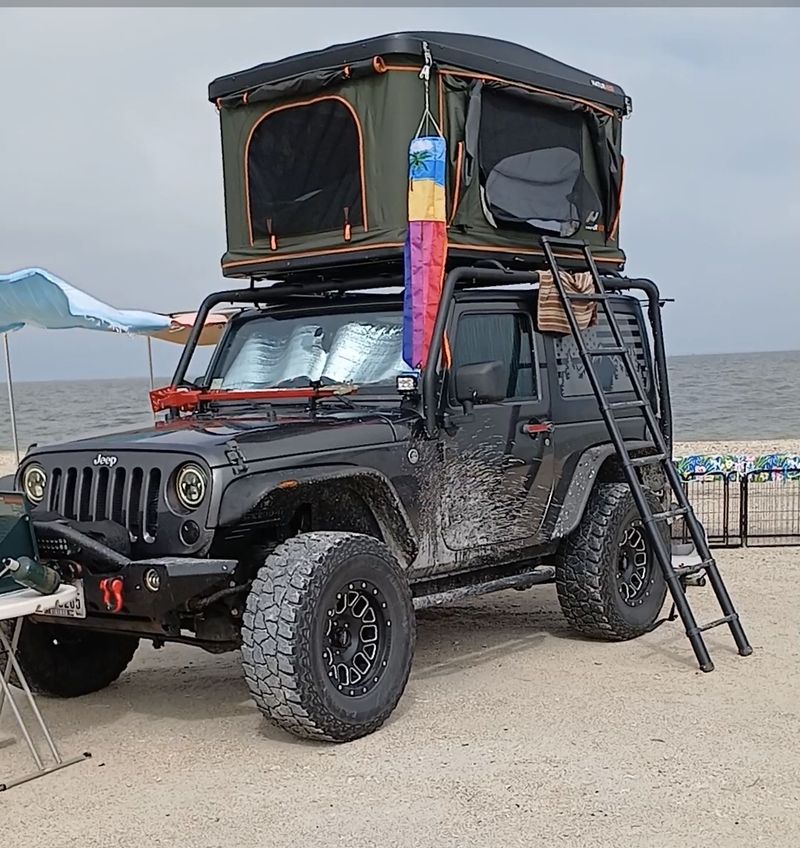 Picture 1/23 of a 4WD Jeep Wrangler with Roof Top Tent for sale in Houston, Texas