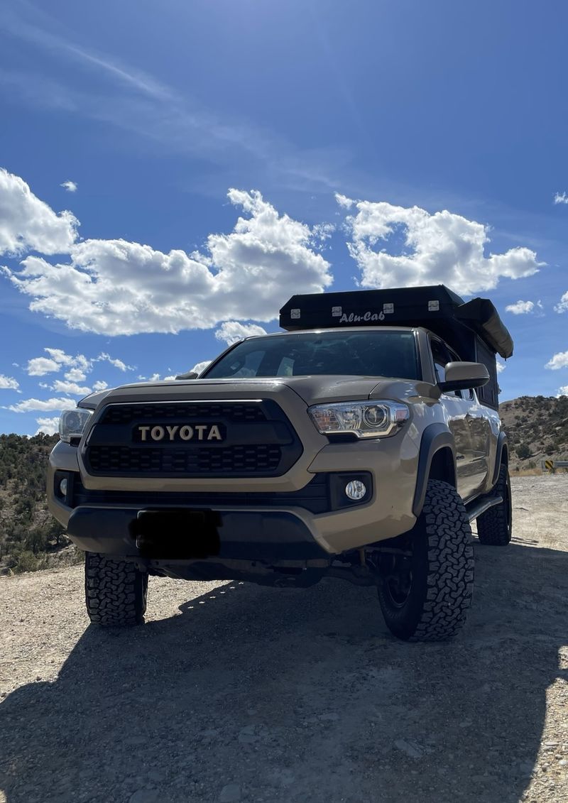 Picture 1/16 of a 2016 Toyota Tacoma TRD OR w/Alu-Cab Canopy Camper for sale in Denver, Colorado