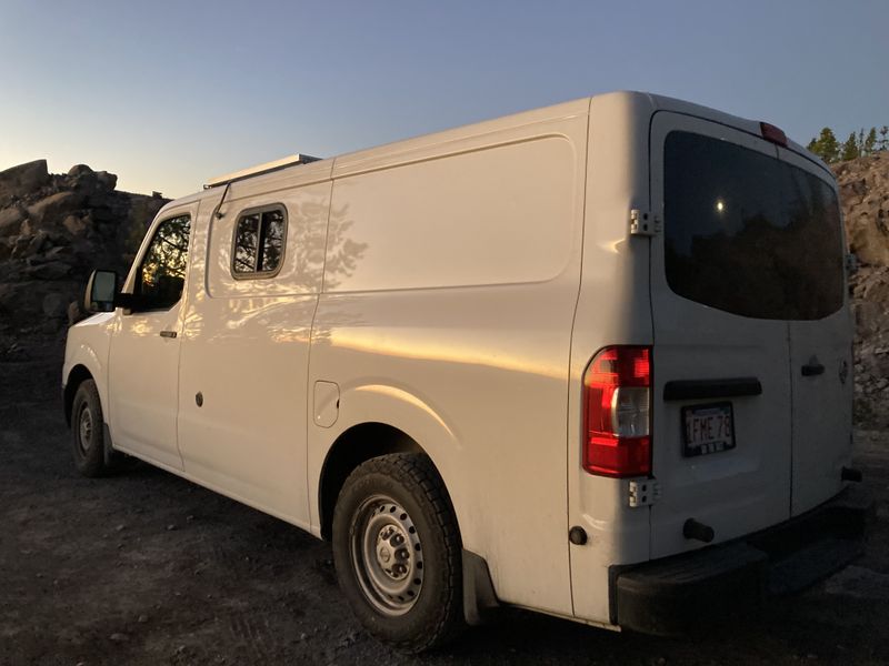 Picture 1/14 of a 2013 Nissan NV 1500 for sale in Big Sky, Montana