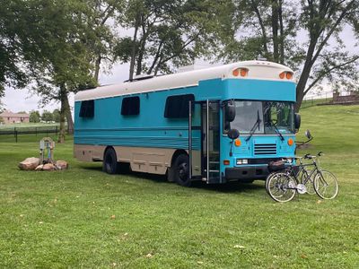 Photo of a Skoolie for sale: 2005 all American bluebird Skoolie with 20 inch roof raise