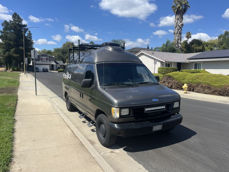 Picture 1/18 of a 1995 Ford E150 medium top for sale in San Jose, California