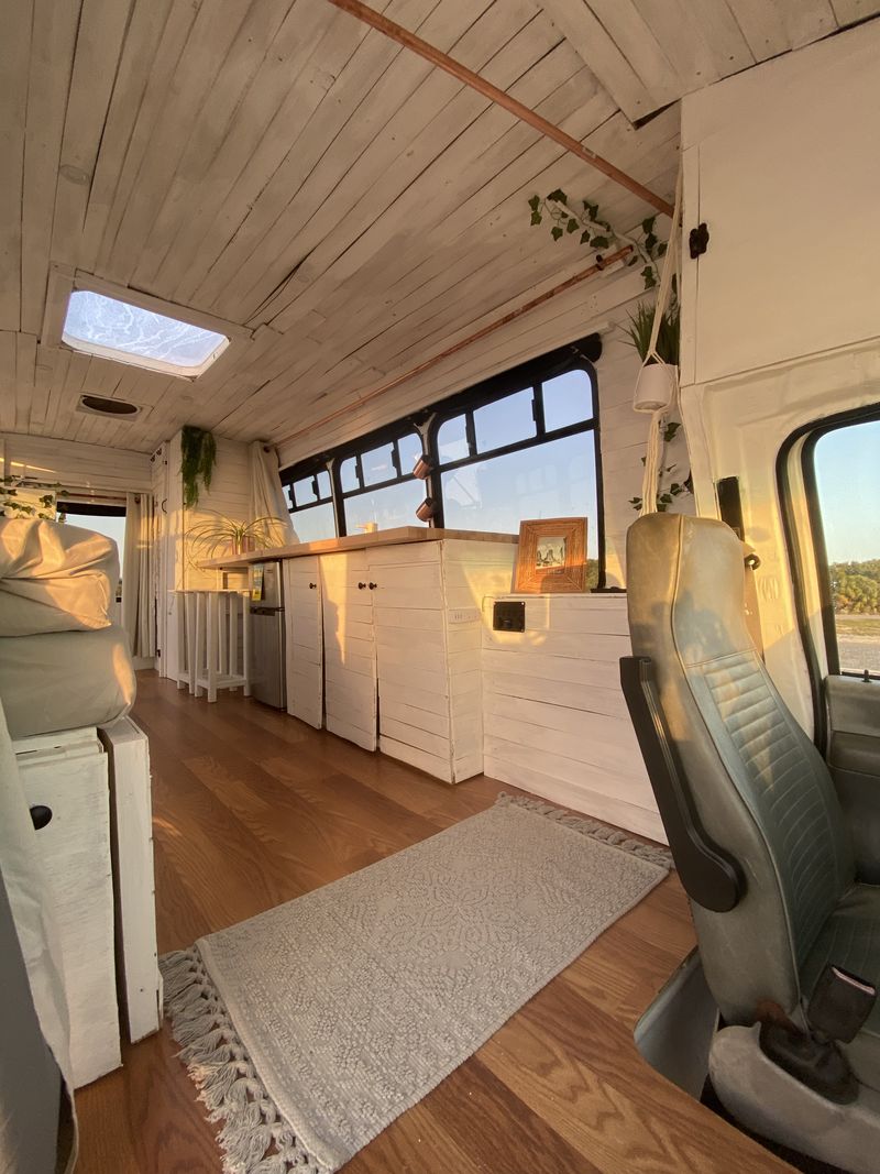 Picture 1/21 of a Boho Dream Skoolie Shuttle Bus with SKYLIGHT + SWING for sale in Saint Petersburg, Florida