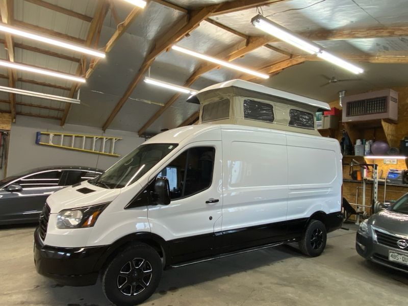 Picture 3/8 of a 2018 Ford T250 Camper Van with pop-up sleeper/camper top for sale in Berthoud, Colorado