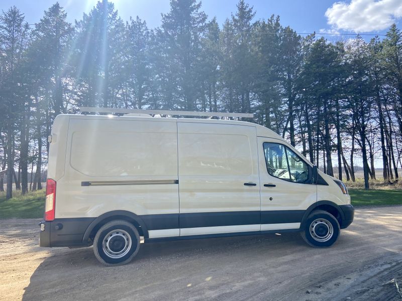Picture 1/10 of a 2015 Ford Transit long wheel base mid roof for sale in Mankato, Minnesota