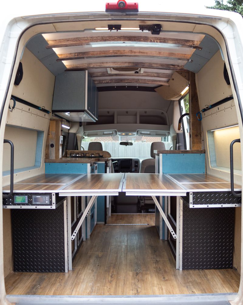 Picture 1/16 of a Nissan NV2500 HD High roof custom camper for sale in Golden, Colorado