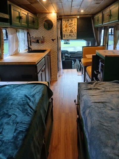 Photo of a Bus Conversion Camper for sale: 2000 Chevy Express 3500 Converted Shuttle Bus