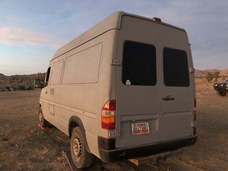 Picture 4/25 of a Camper Van for sale: kitchen, queen bed, table, storage for sale in Salt Lake City, Utah