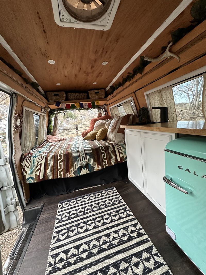 Picture 1/8 of a 2000 GMC Savana Boho Camper Van 🌻 for sale in Golden, Colorado