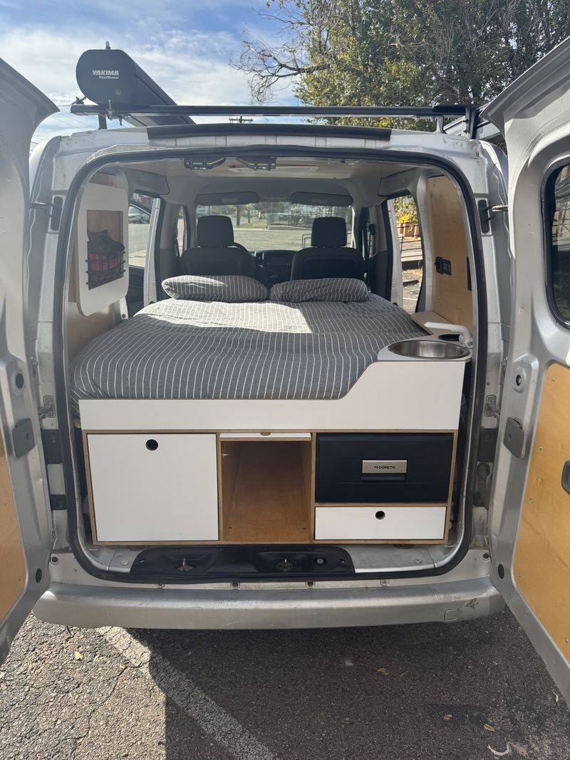 Picture 1/12 of a 2013 Nissan NV200 Microvan for sale in Denver, Colorado