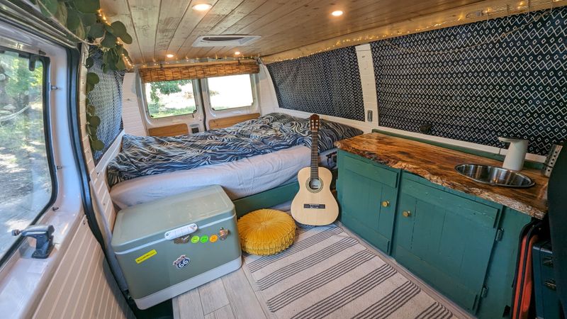 Picture 1/18 of a 2003 Ford E-150 stealthy camper van build for sale in Linden, Michigan