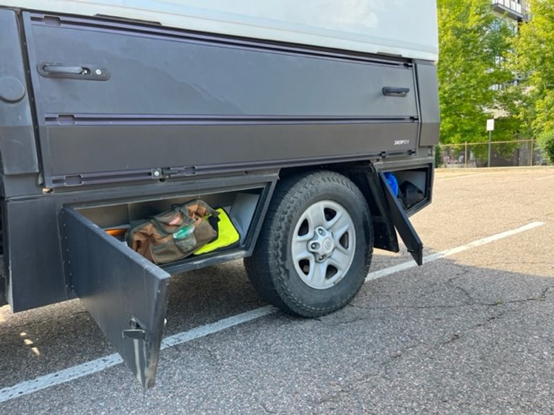 Picture 4/26 of a Toyota Tundra with Flatbed and Fiberglass Camper Shell for sale in Denver, Colorado