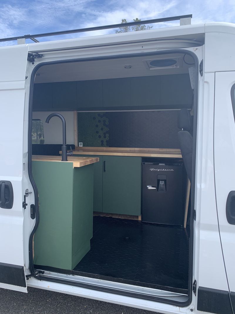 Picture 1/7 of a 2019 ram promoter off grid camper for sale in Tampa, Florida