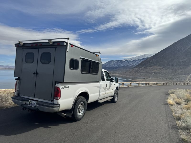 Picture 1/8 of a 2003 F250 with topper for sale in Billings, Montana