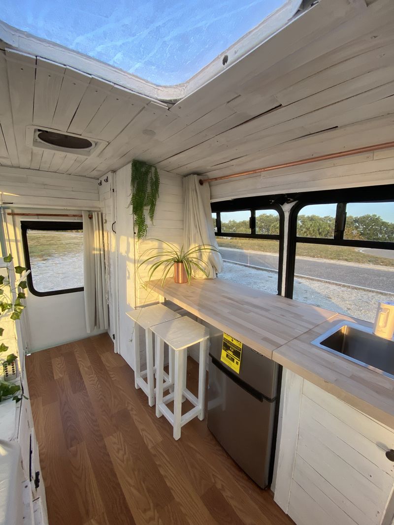 Picture 6/21 of a Boho Dream Skoolie Shuttle Bus with SKYLIGHT + SWING for sale in Saint Petersburg, Florida