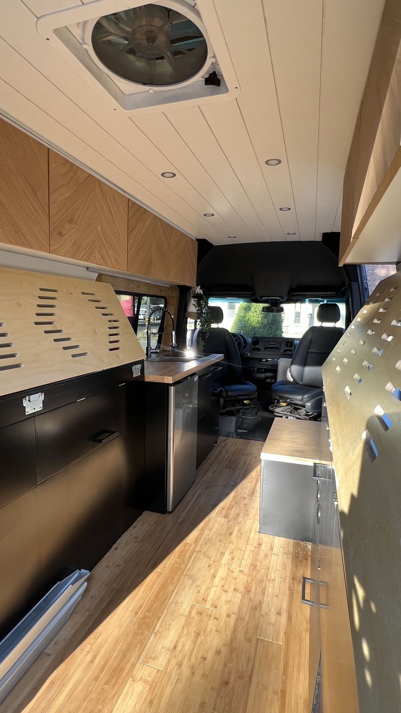 Picture 4/30 of a NEW 144 Sprinter with indoor shower, 12v A/C and folding bed for sale in Big Bear City, California