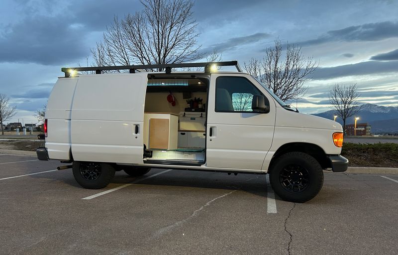 Picture 1/9 of a 2007 Ford E150 Super Duty Adventure 2WD for sale in Colorado Springs, Colorado