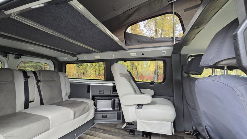 Picture 2/28 of a 2012 Nissan NV3500 HD Roadtrek Pop Top Camper Van for sale in Missoula, Montana
