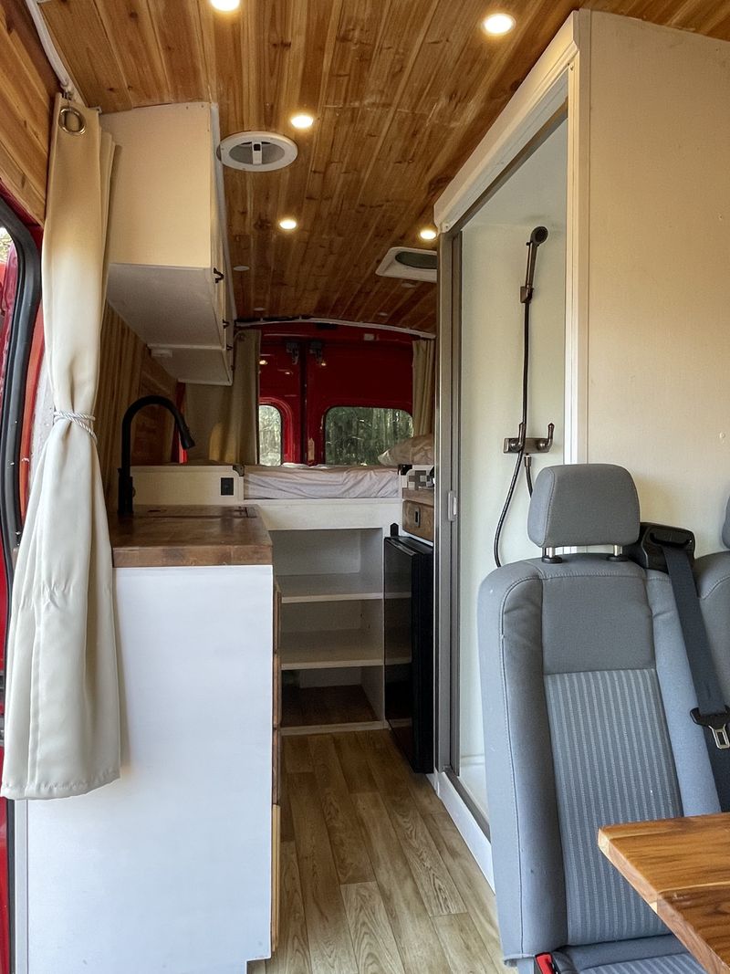 Picture 1/18 of a 2015 Ford Transit High Roof with hot shower, seats 4! for sale in Maynard, Massachusetts