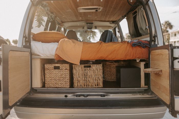 Photo of a bed and rear storage in a 2002 Chevy Astro Campervan