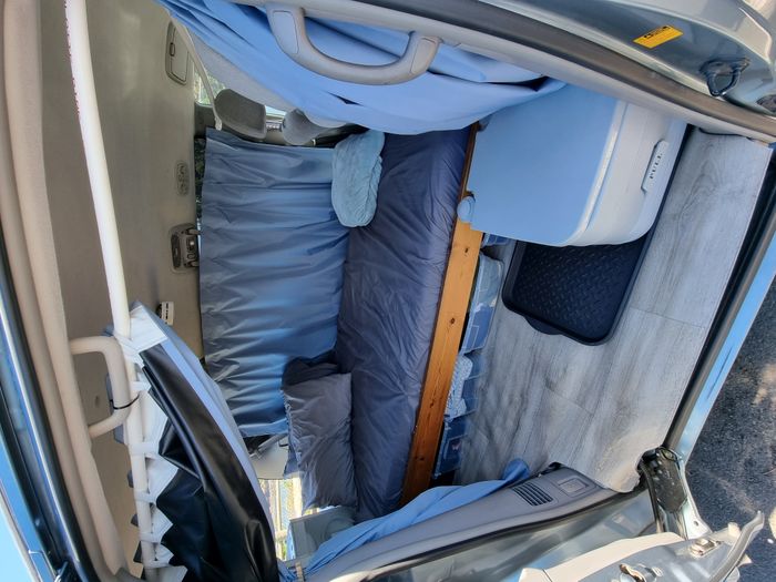 Photo showing the bed of a 2006 Toyota Sienna Campervan