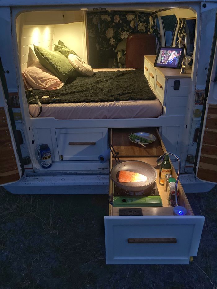 Photo of the rear kitchen in a 1974 Dodge Boogievan "Shorty" campervan at night